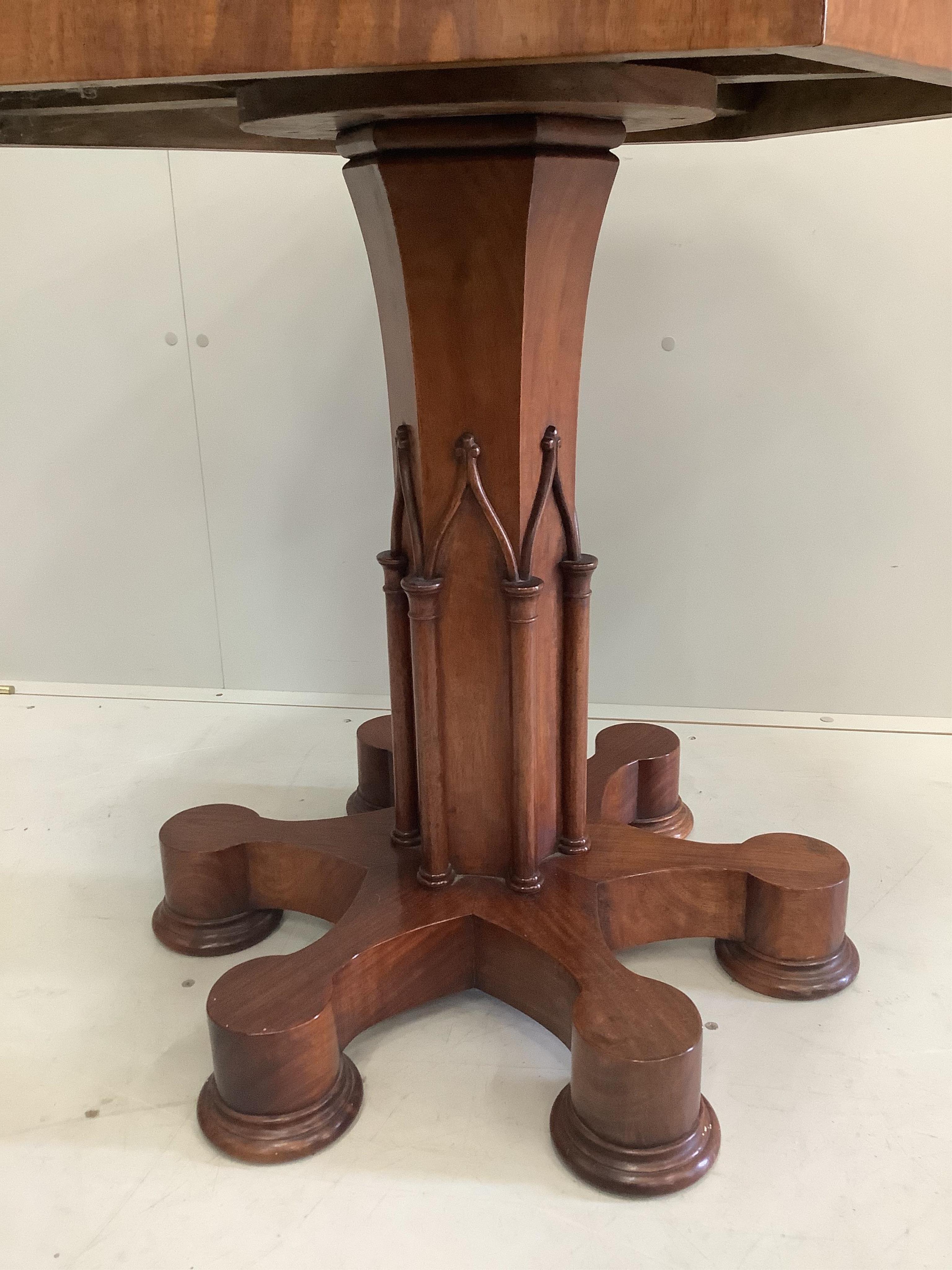 A Gothic style mahogany parquetry inlaid hexagonal centre table, width 81cm, height 75cm. Condition - fair